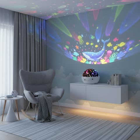 Room with colorful ceiling projection, gray armchair, and decorative lamp.