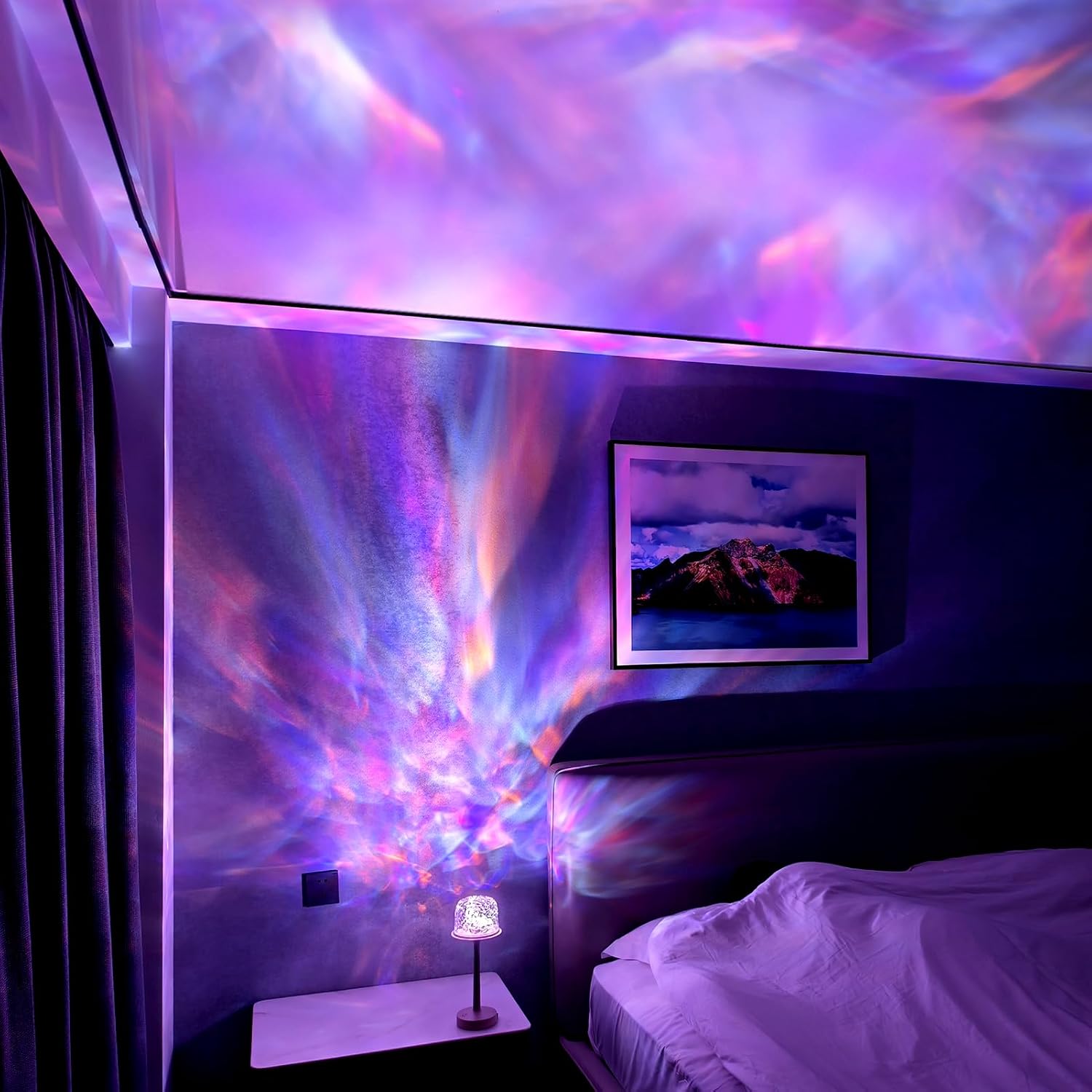 Room with colorful light display on ceiling and wall, bed in foreground