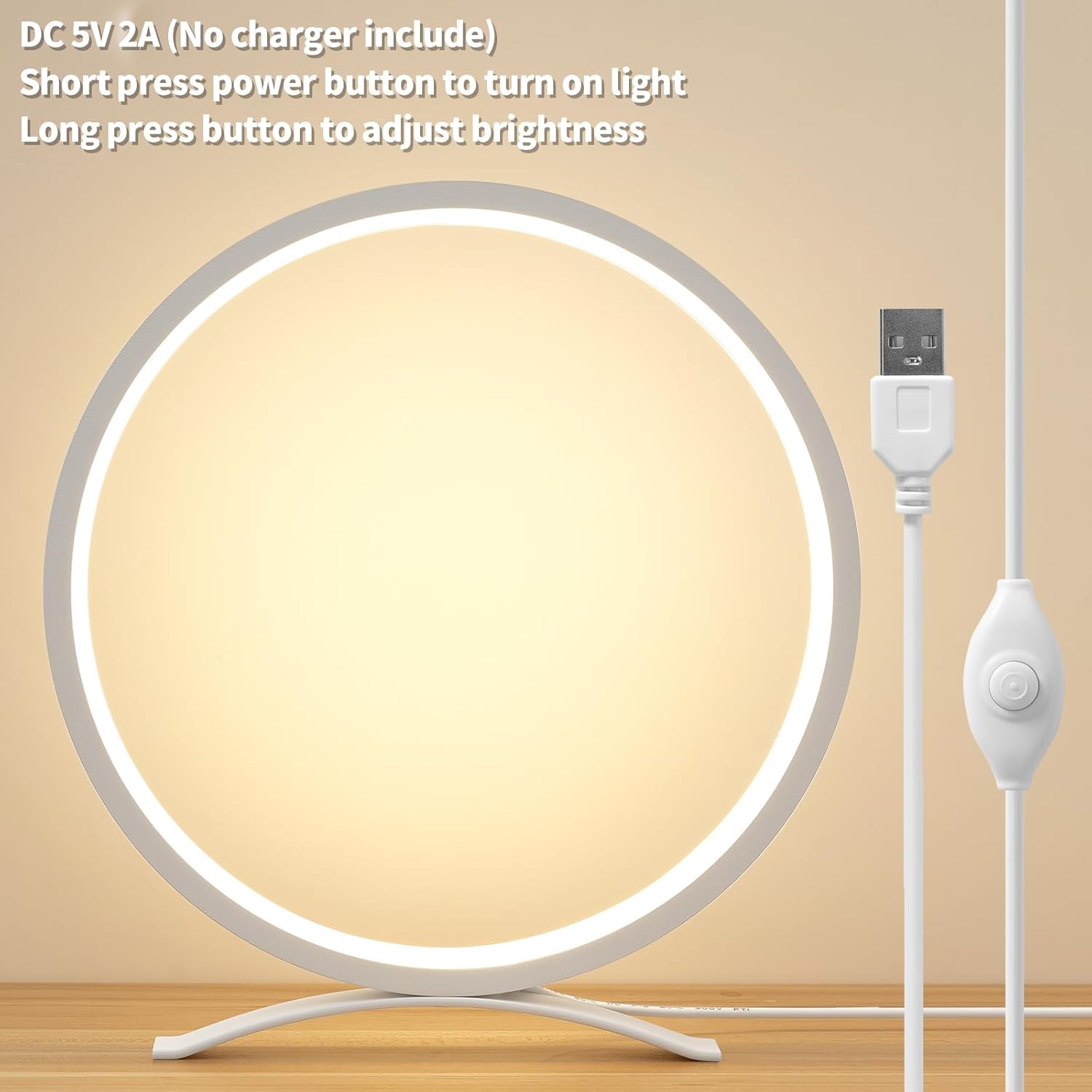 Round LED light with USB cable on a beige background