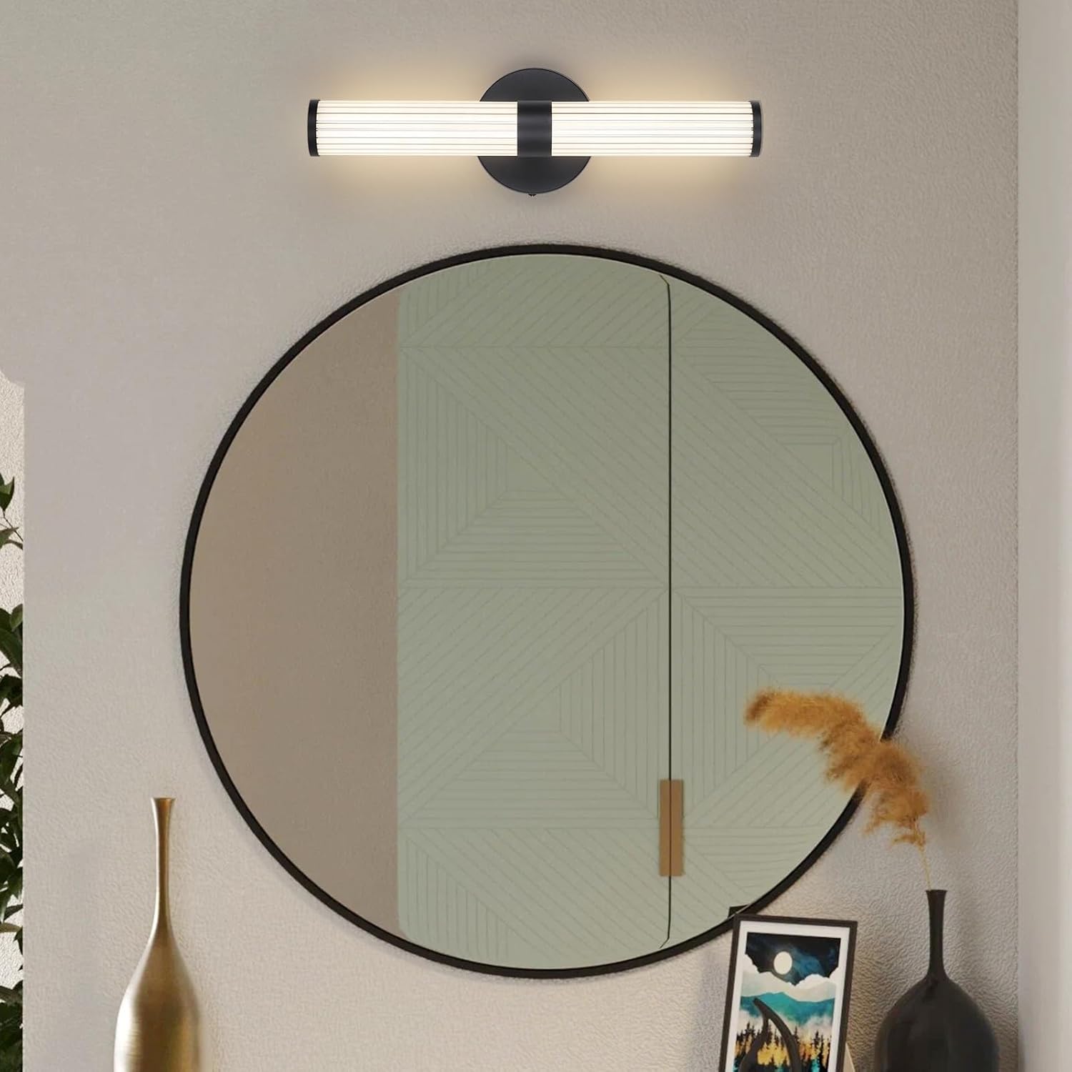 Round mirror with black frame on a wall with decorative elements