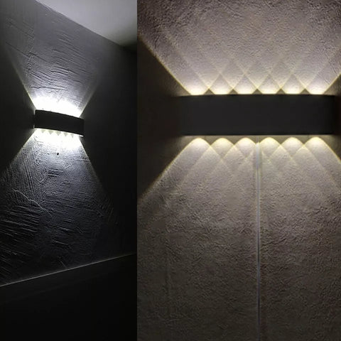 Stylish black aluminum wall sconce providing warm white illumination

