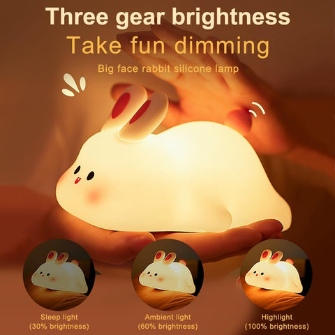 Silicone lamp shaped like a rabbit with three brightness settings on a brown background