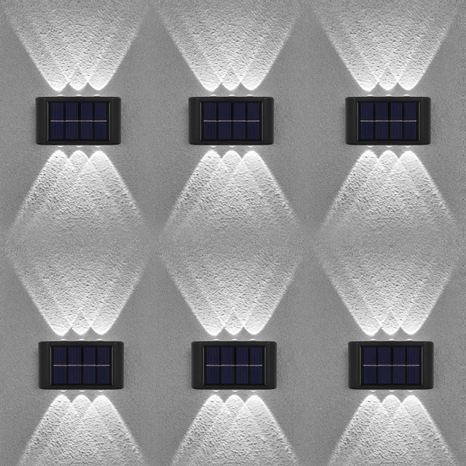 Six solar-powered wall lights on a textured gray wall.