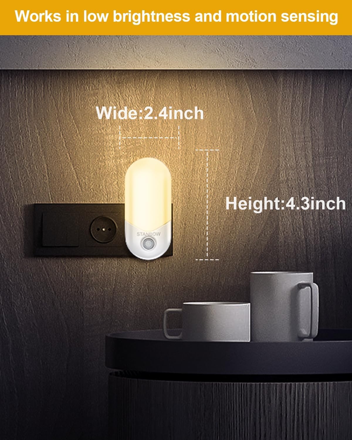 Small night light on a wall with dimensions labeled, placed next to a mug.