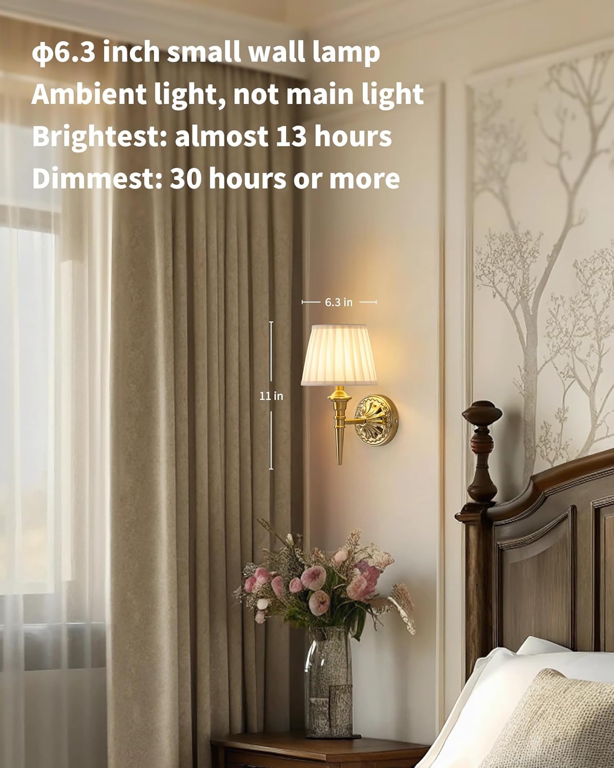 Small wall lamp on a wall next to a bed with curtains and a vase of flowers.