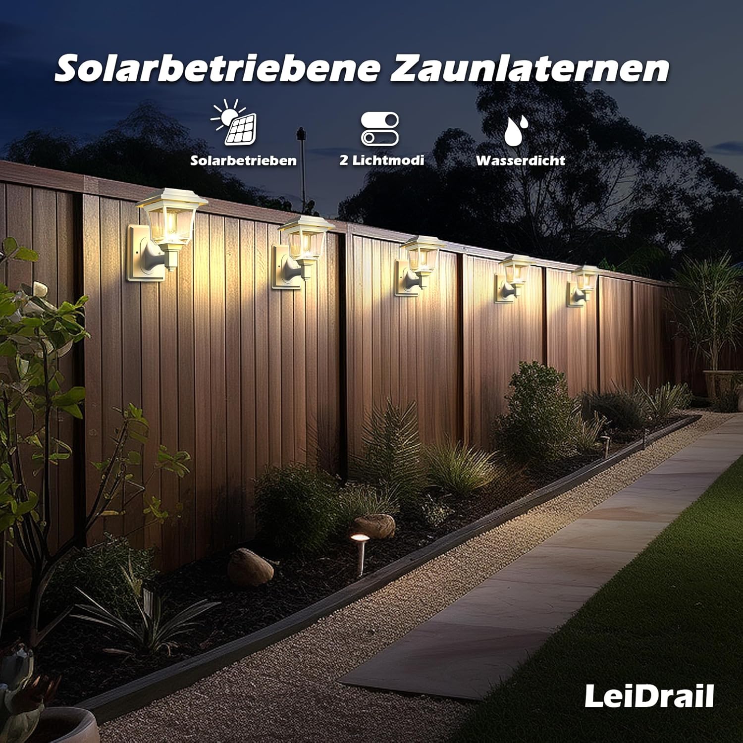 Solar-powered fence lanterns on a wooden fence with garden pathway and plants.