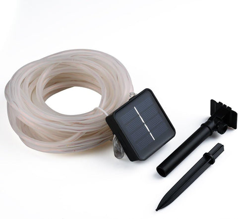 Solar-powered irrigation system with hose, solar panel, and nozzles on a white background