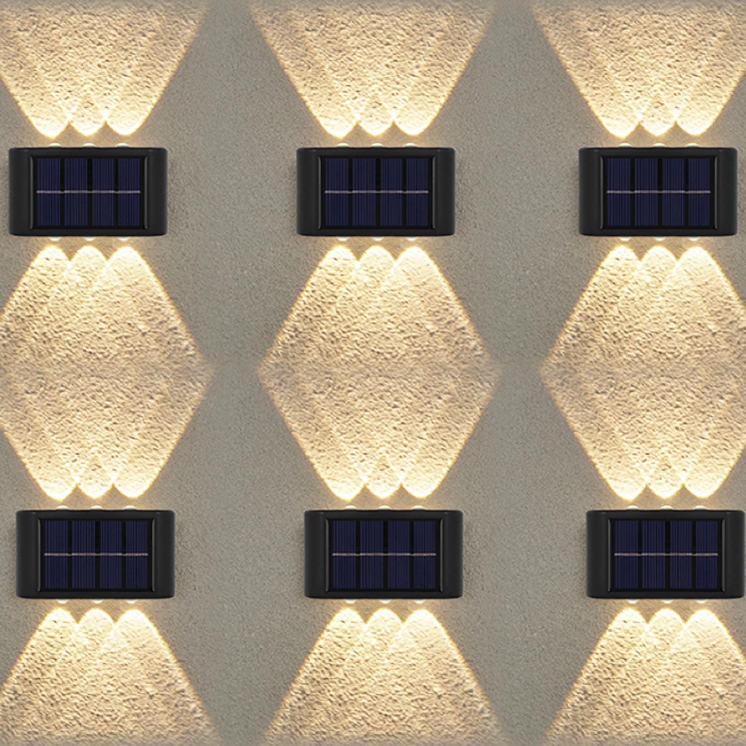 Solar-powered wall lights on a textured wall