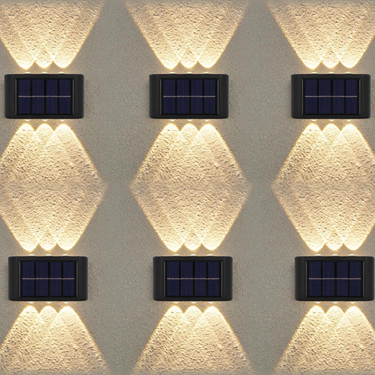 Solar-powered wall lights on a textured wall