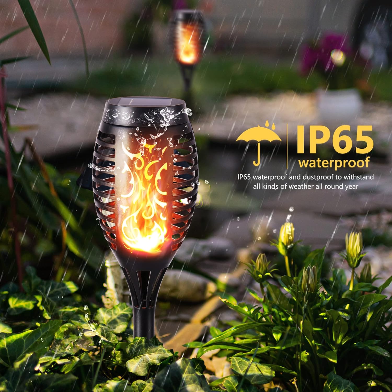 Solar garden light with flame effect in a garden setting, featuring IP65 waterproof rating.