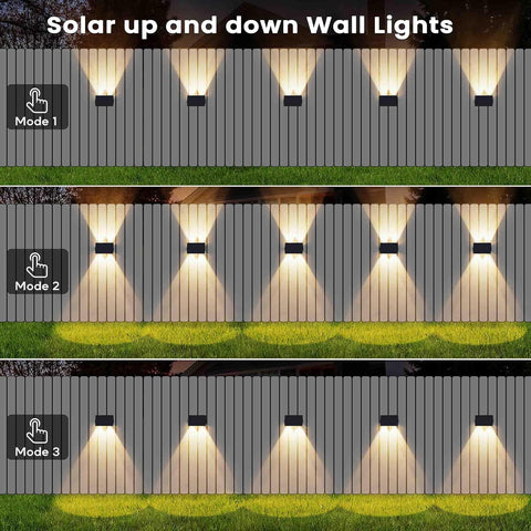 Solar up and down wall lights with different modes on a wooden fence background.