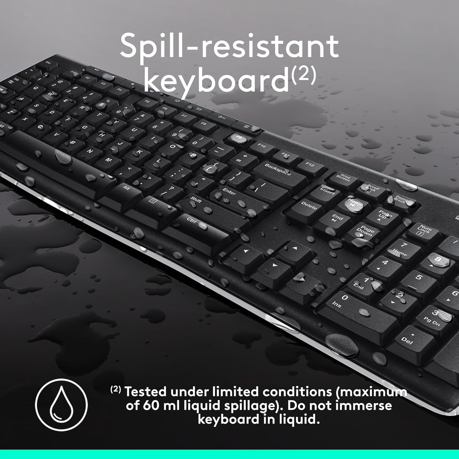 Spill-resistant keyboard with water droplets on a dark surface