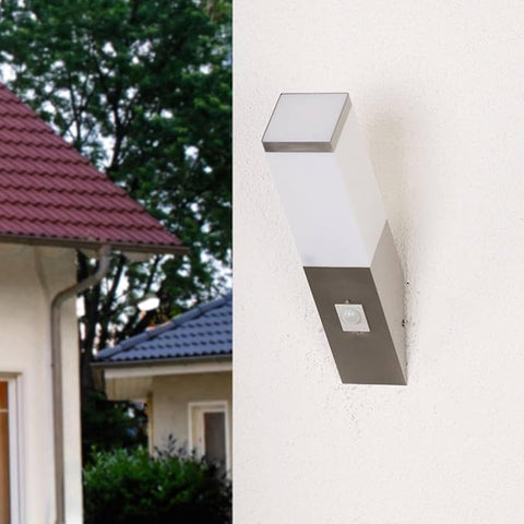 Stylish outdoor wall light providing illumination in a patio setting

