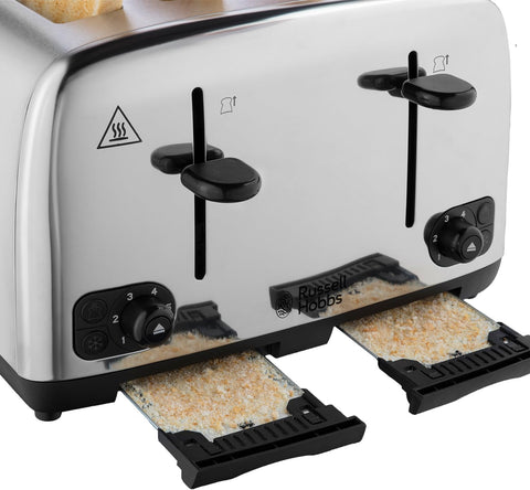 Stainless steel toaster with bread slices on a white background