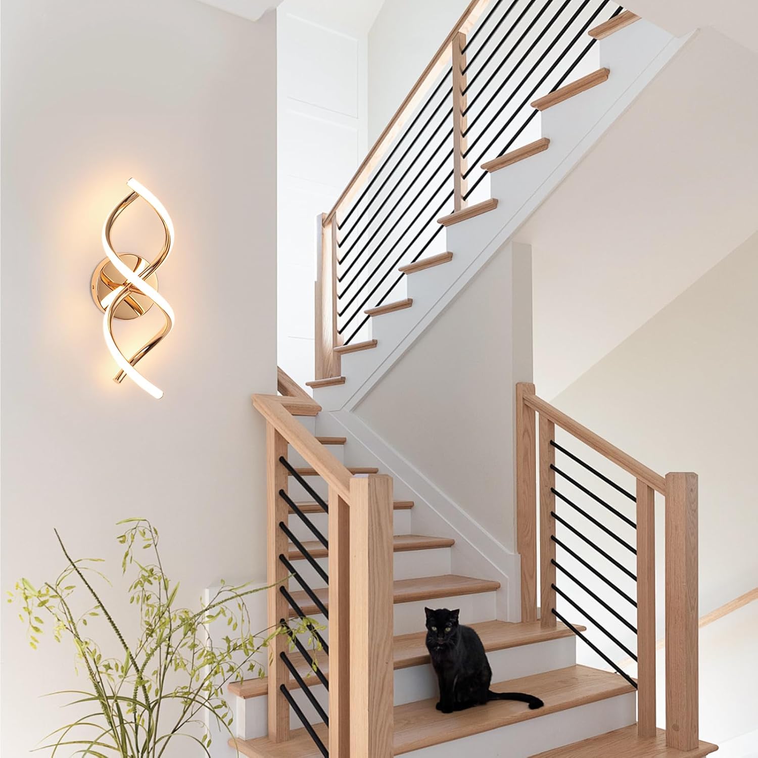 Staircase with wooden steps and black railings, featuring a black cat sitting on a step.