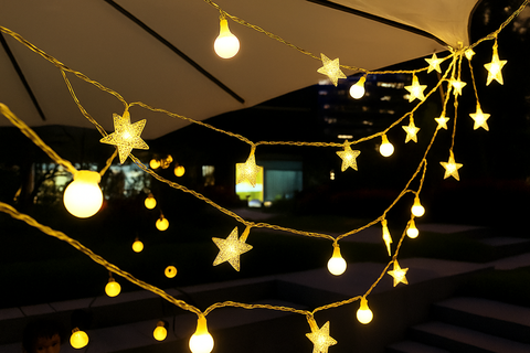 Star-shaped string lights hanging from a ceiling