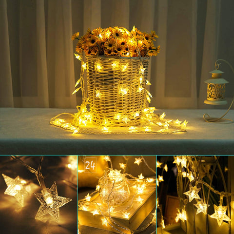 Snowflake fairy lights draped over a fireplace mantel

