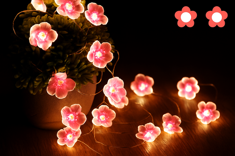 String lights shaped like pink flowers 