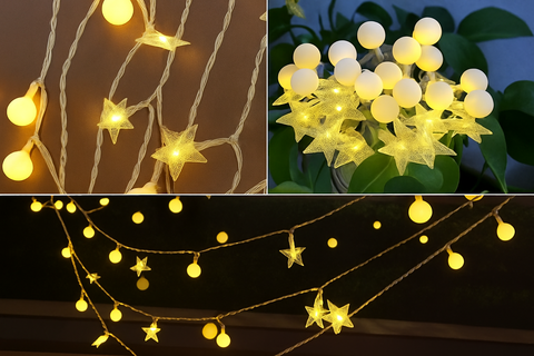 String lights with star and ball designs in use on a dark background.
