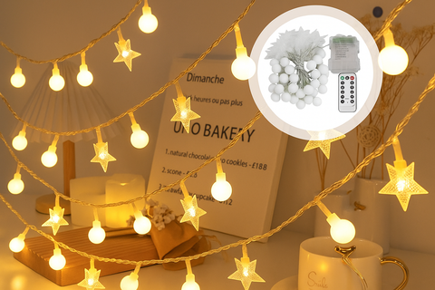 String lights with star decorations on a table, including a close-up of the remote control.