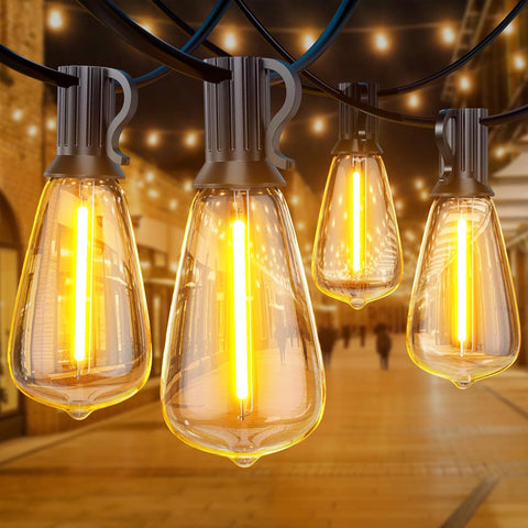 String of vintage-style light bulbs with a warm glow, hanging against a blurred indoor background.