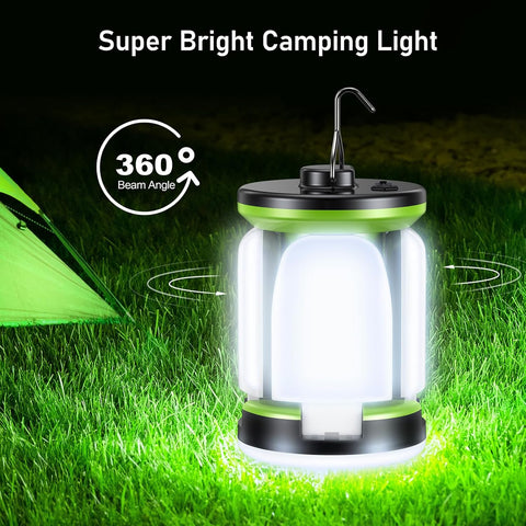 Super bright camping light on grass with tent in the background