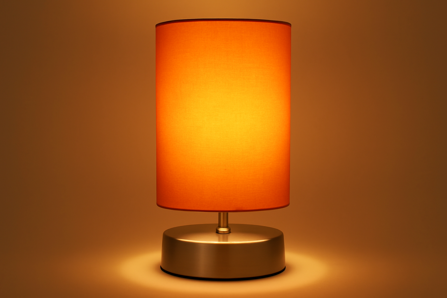Table lamp with an orange shade on a brown background