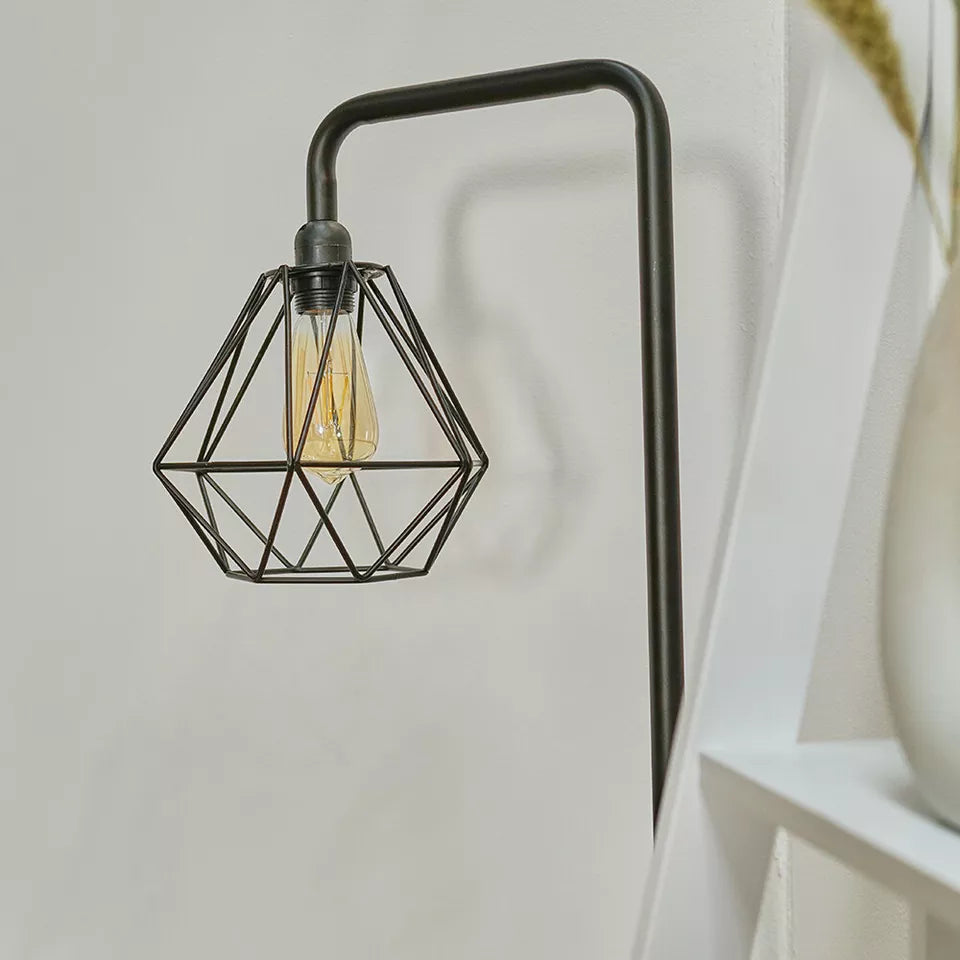 Close-up of the copper lamp holder on the industrial floor lamp.​


