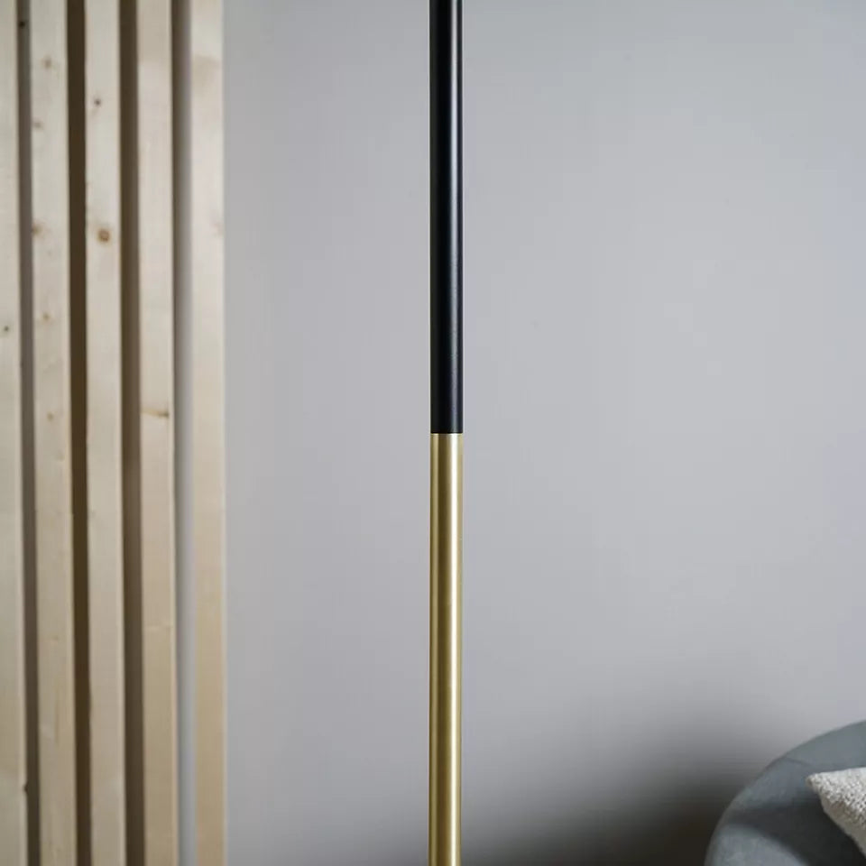 Metal frame of the floor lamp with a matte black finish.​
