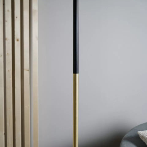 Metal frame of the floor lamp with a matte black finish.​
