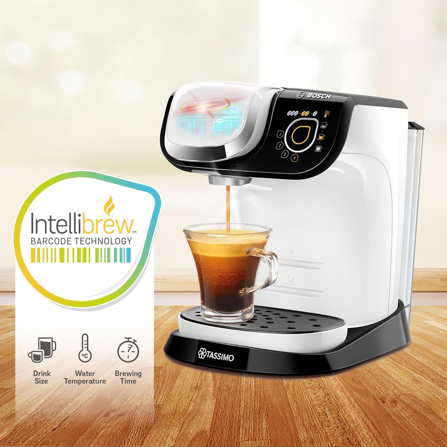 Tassimo coffee machine with a cup of coffee and IntelliBrew packaging on a wooden surface.