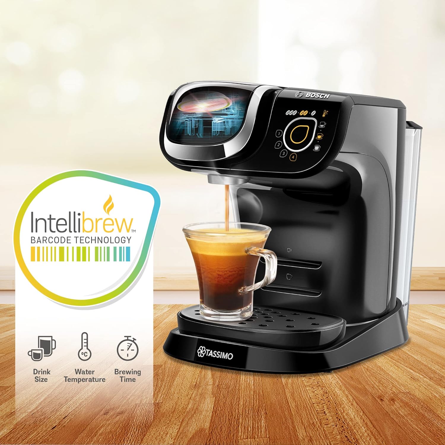 Tassimo coffee machine with a glass of coffee and IntelliBrew technology label on a wooden surface.