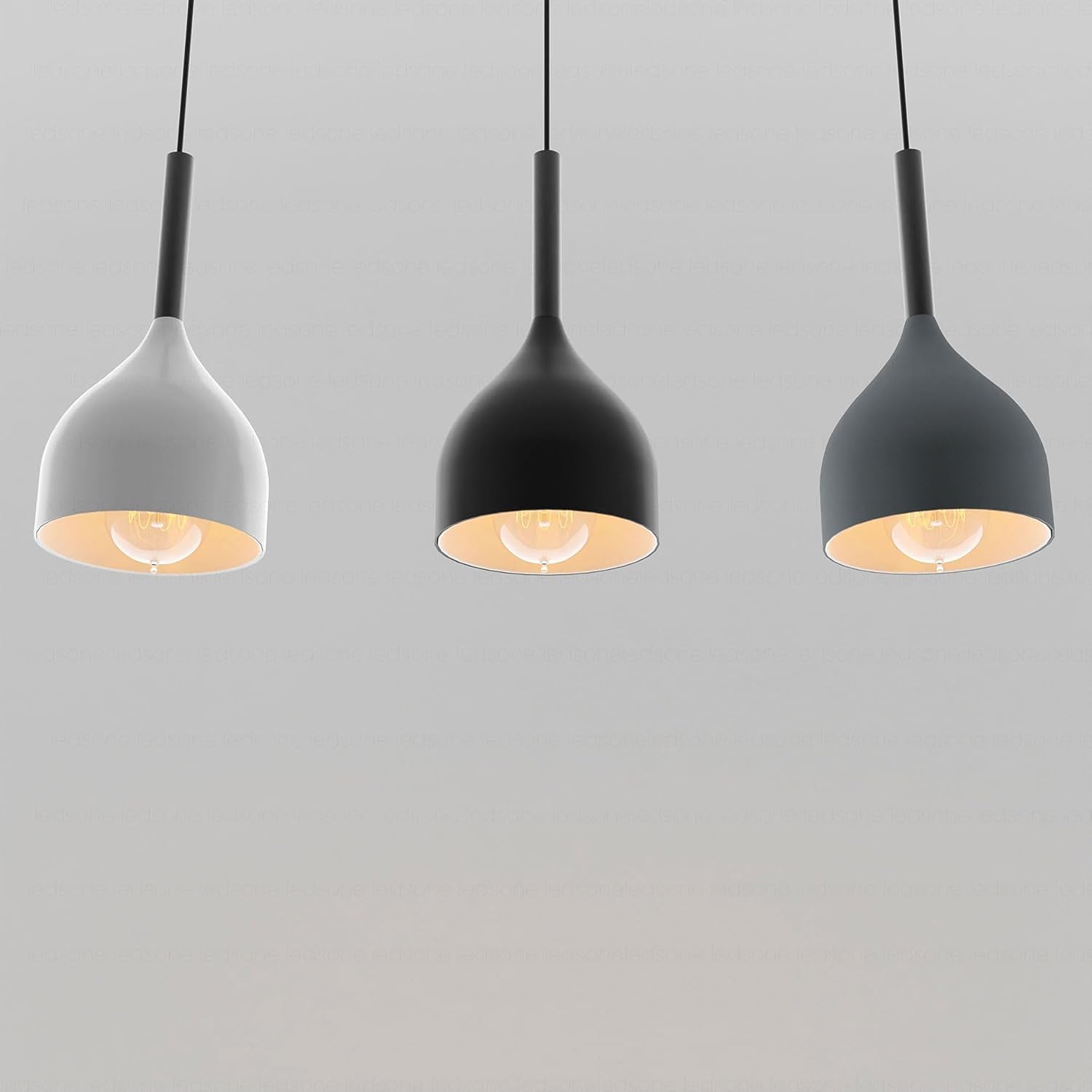 Three pendant lights with different shades of gray on a gray background