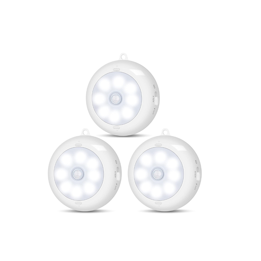 Three white motion sensor lights on a white background