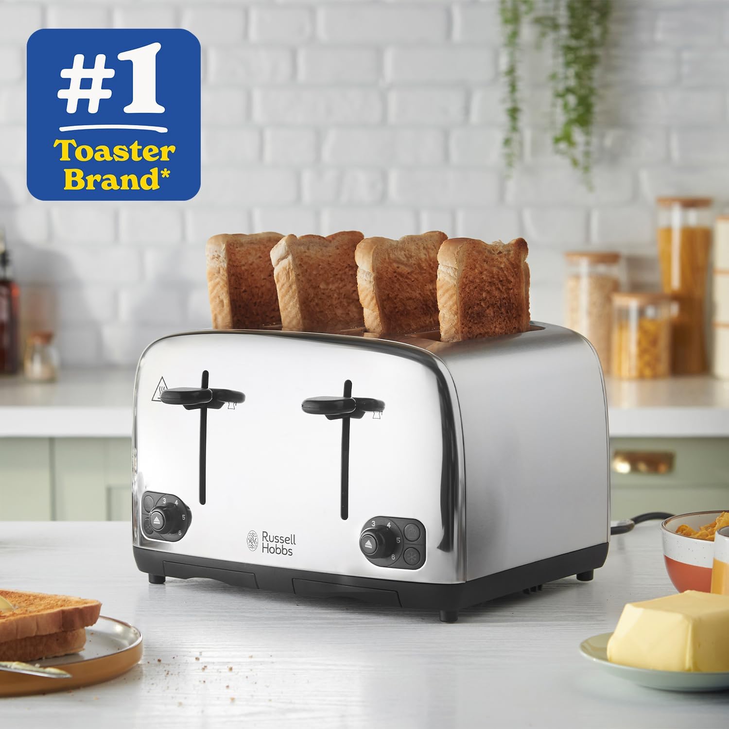 Toaster with four slices of toast on a kitchen counter, featuring the brand logo.