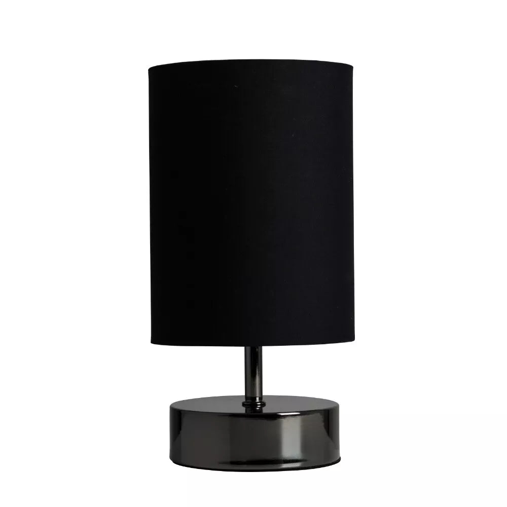 Touch table lamp with black fabric lampshade on UK bedside table.


