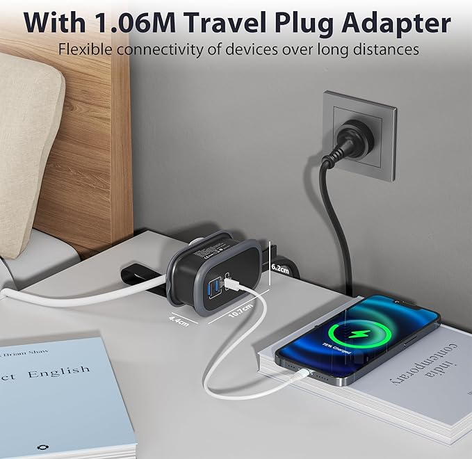 Travel plug adapter charging a smartphone on a nightstand with a book.