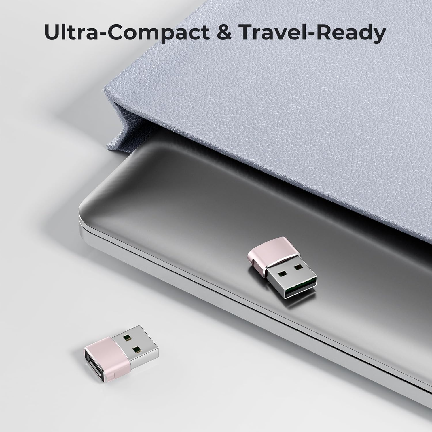 Two Pink USB drives on a surface with a laptop and text 'Ultra-Compact & Travel-Ready'.