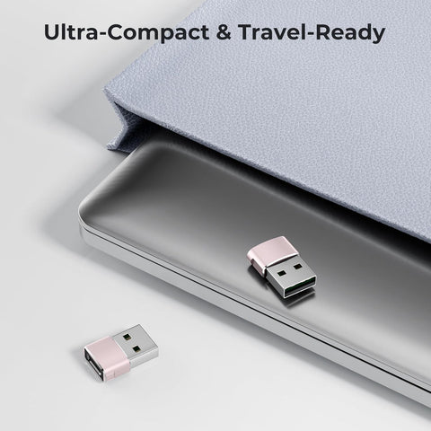 Two Pink USB drives on a surface with a laptop and text 'Ultra-Compact & Travel-Ready'.