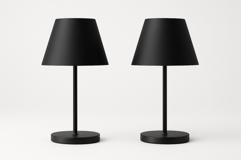 Two black table lamps on a white background