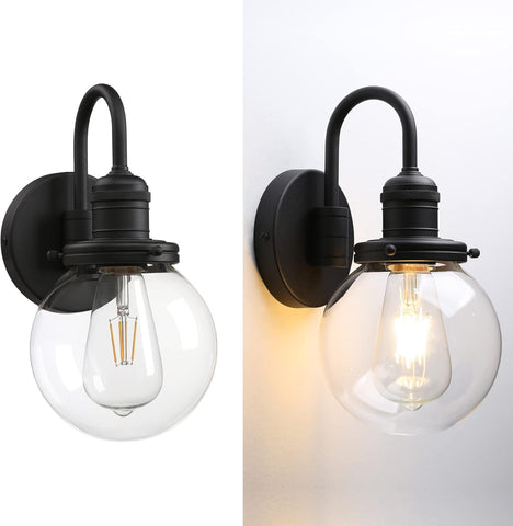 Two black wall sconces with clear glass shades on a white background