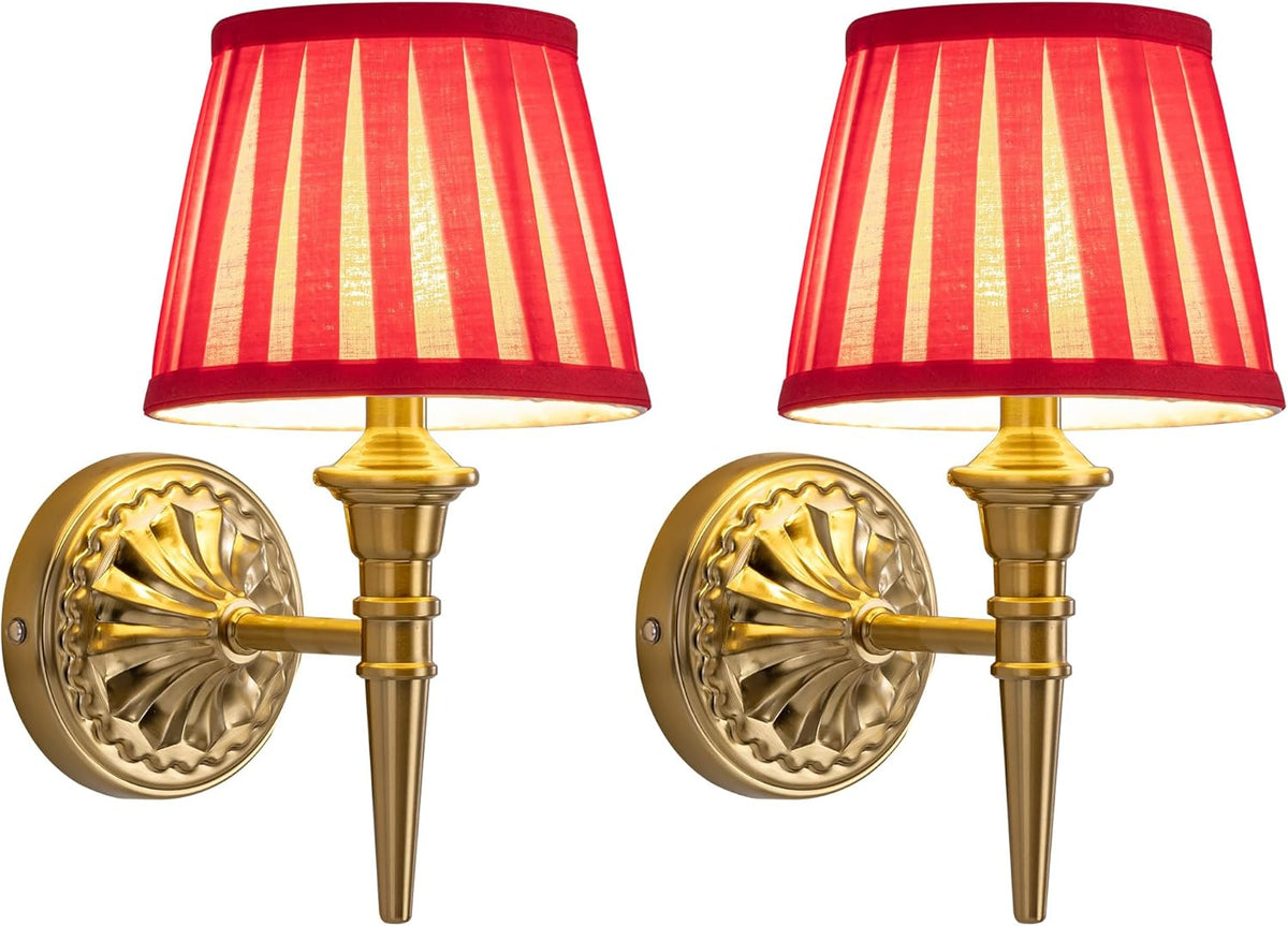Two gold wall sconces with red striped lampshades on a white background