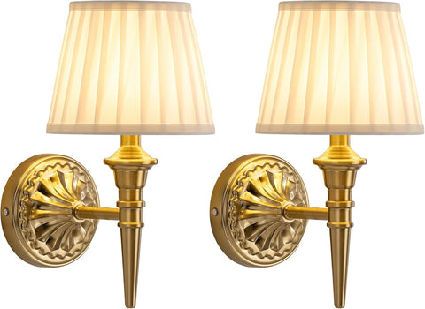 Two gold wall sconces with white lampshades on a white background
