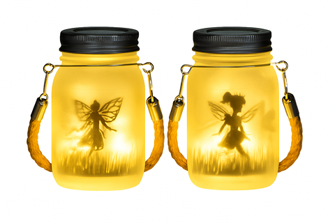 Two illuminated mason jar lanterns with fairy silhouettes on a white background