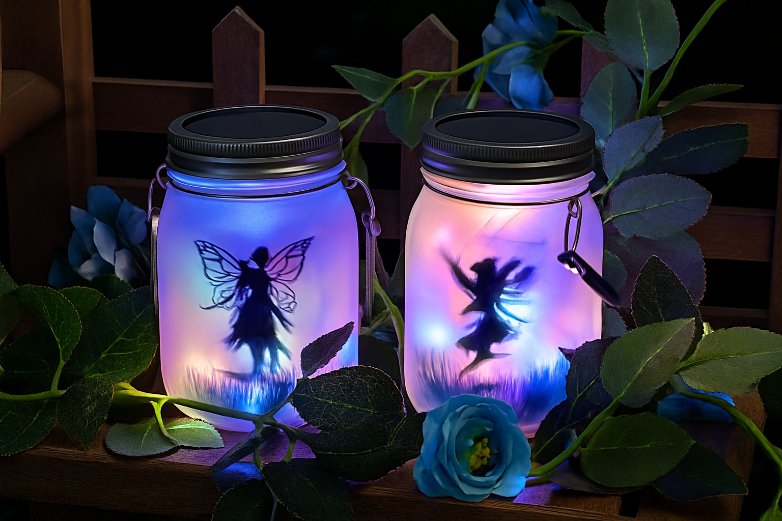 Two illuminated mason jars with fairy silhouettes on a dark background with foliage.