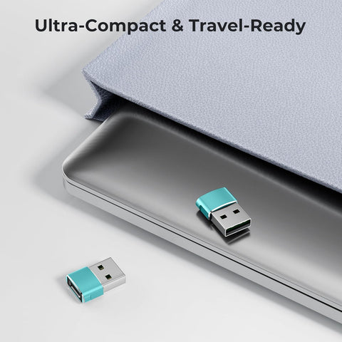 Two small USB drives with a teal accent on a light gray surface, with text 'Ultra-Compact & Travel-Ready' above.