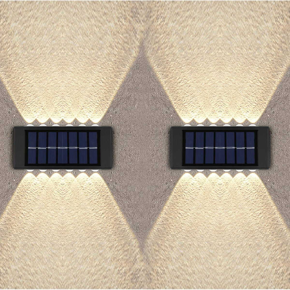 Two solar-powered wall lights on a textured wall.