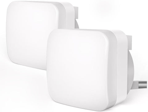 Two white power adapters on a white background