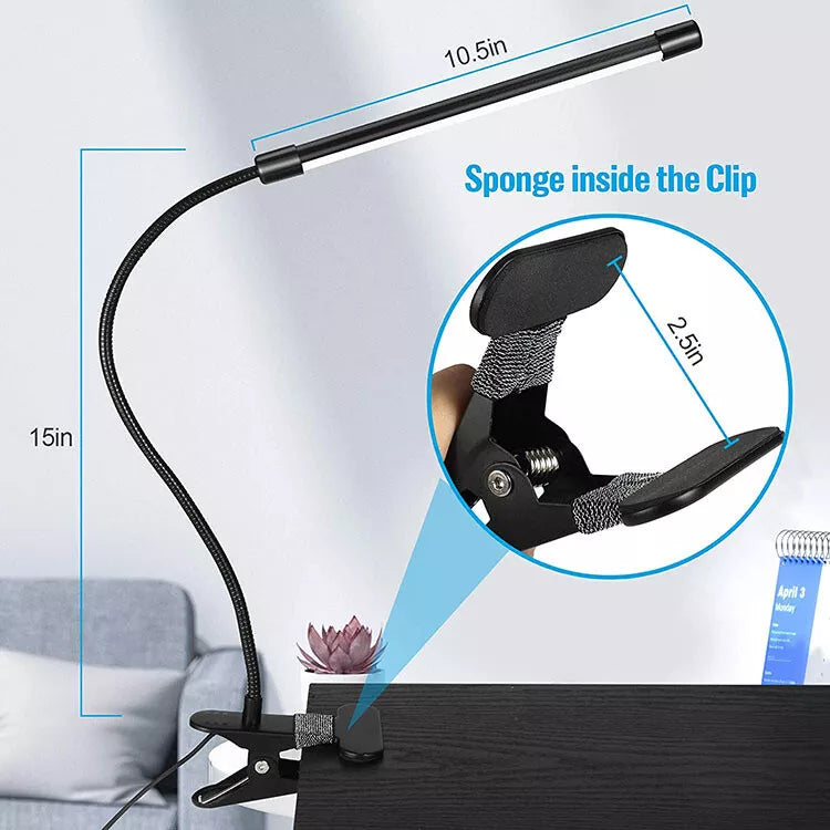 Black clip-on lamp in a modern home office

