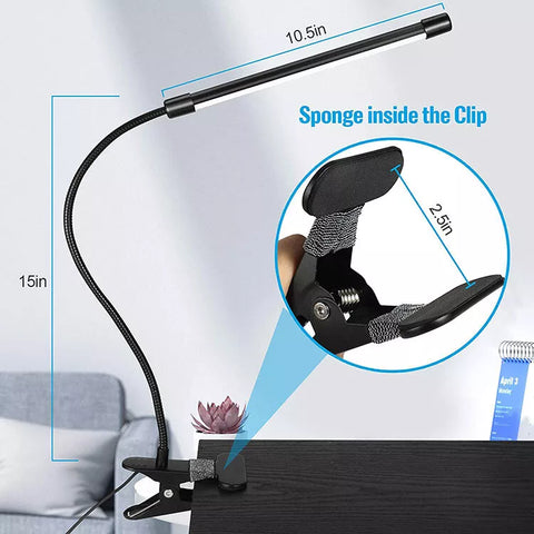 Black clip-on lamp in a modern home office

